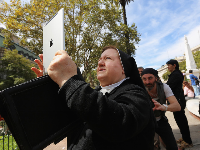 Quiz: Are they in line for the pope or iPhones?