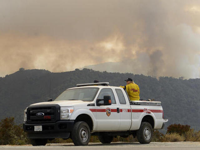 Wildfires burn in 7 Western states, force evacuations