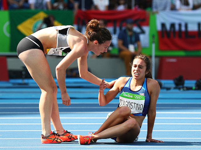 Olympic spirit shines as runner helps competitor up