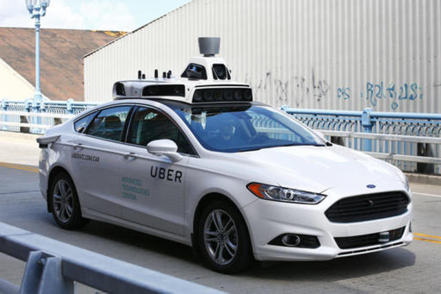 Uber offers rides in Pittsburgh as self-driving cars go public