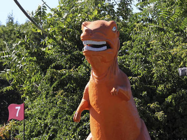 Orange dinosaur at mini golf course saved from extinction