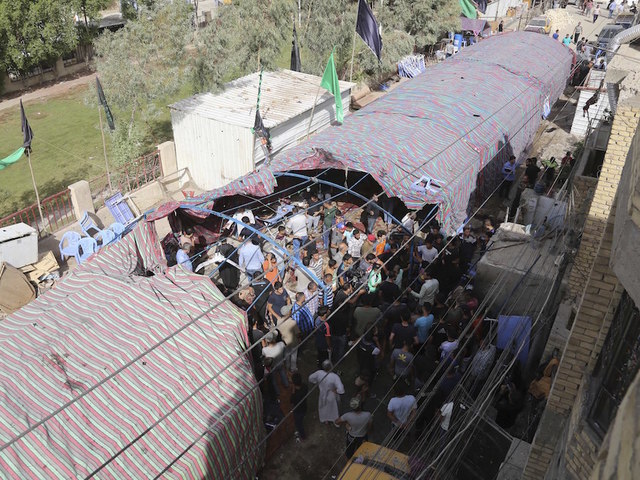 Suicide bombing at Baghdad funeral kills, injures nearly 100 people