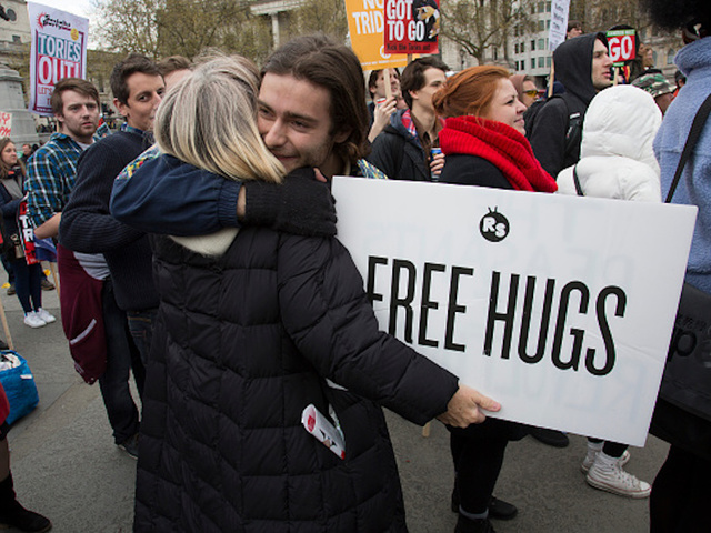 Woman upset by Trump victory spends day giving out free hugs
