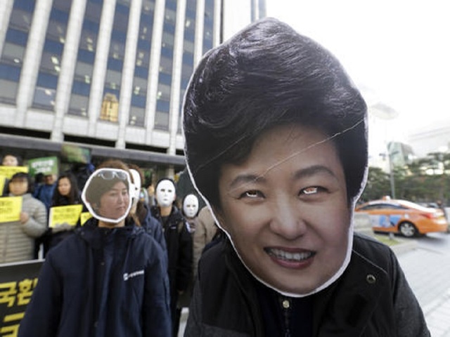 South Korean leader says she'll resign after lawmakers act