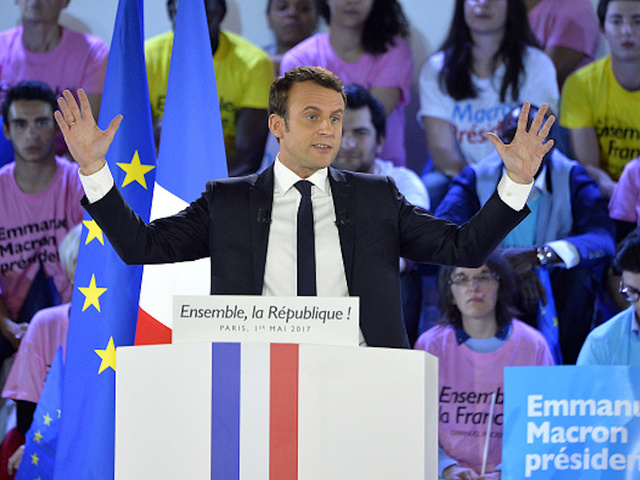 Obama-backed candidate Macron projected to win divisive French election