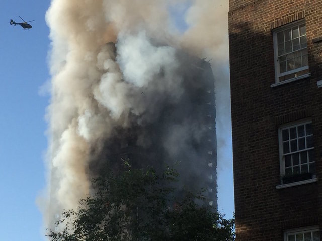Baby tossed from 10th-story window during London fire caught by man