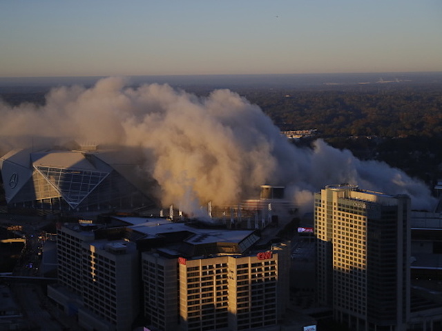 City bus photobombs network's coverage of stadium implosion
