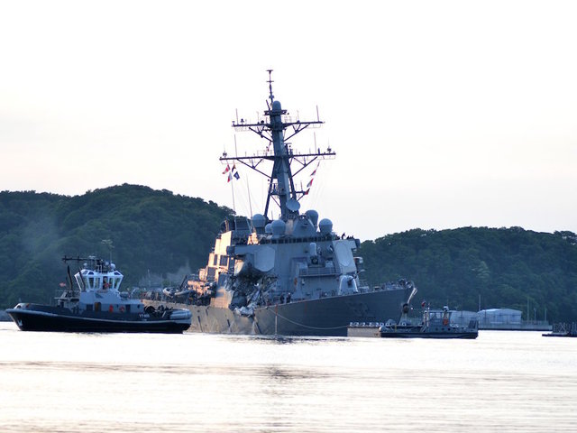 Crippled US destroyer damaged by transport ship
