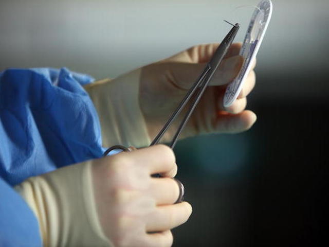 British surgeon admits to branding initials on patients' livers