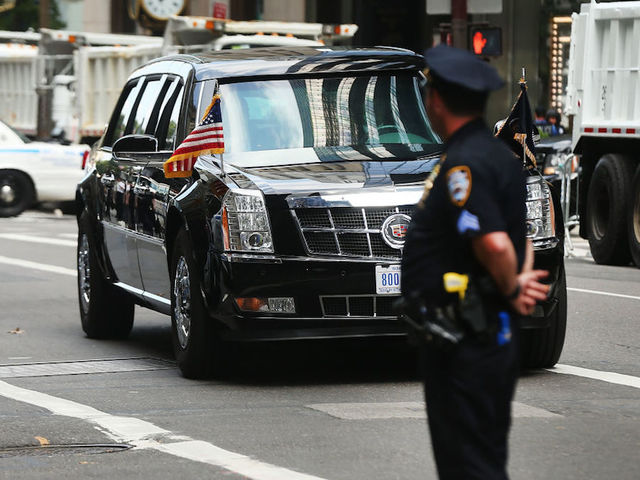 Woman who claims she was fired for flipping off Trump motorcade sues former employer