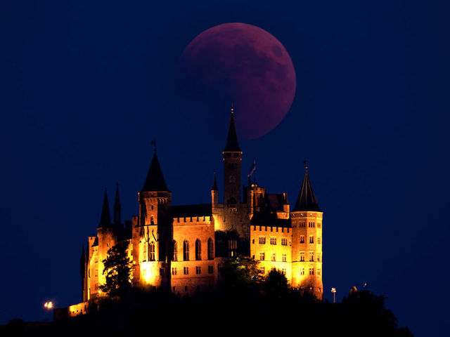 Photos: Lunar eclipse offers thrilling views of 'blood moon' across the world