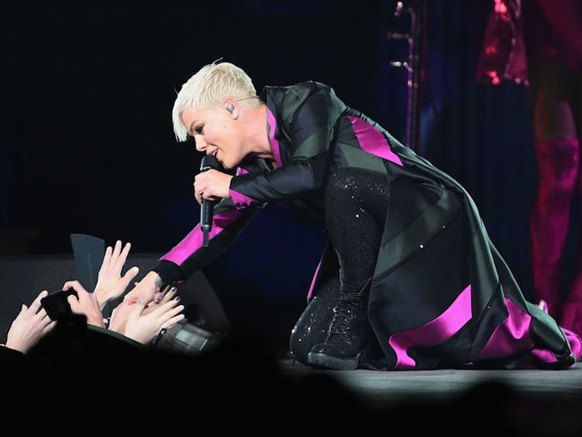Pop musician Pink stops concert to hug grieving fan
