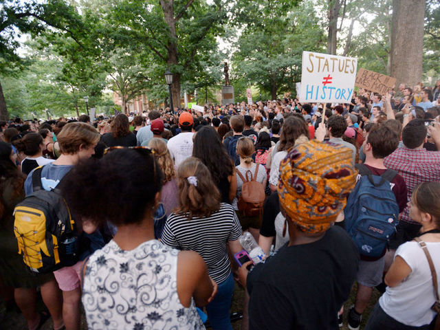 Arrests made as protests converge over toppled Confederate statue