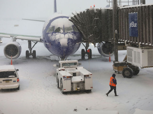 Wintry blast causes more than 1,000 flight cancelations, blizzard warning for millions